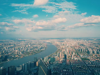 High angle view of buildings in city against sky