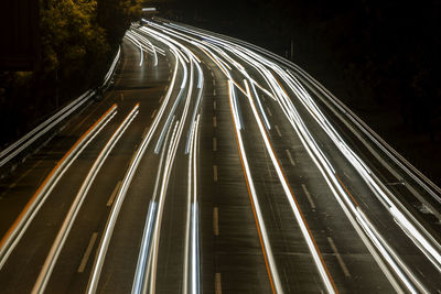 High angle view of light trails on road at night