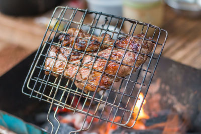 Close-up of beef steaks in barbeque grill