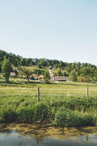 Scenic view of field against clear sky