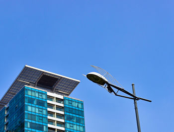 Low angle view of building against clear blue sky