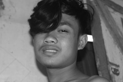 Close-up portrait of young man looking away