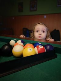 Cute girl by pool table