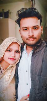 Portrait of young couple smiling