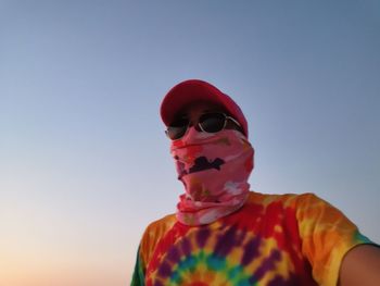 Portrait of boy wearing sunglasses against clear sky