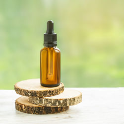 Close-up of yellow bottle on table