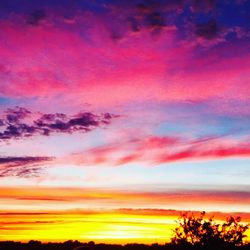 Low angle view of cloudy sky at sunset
