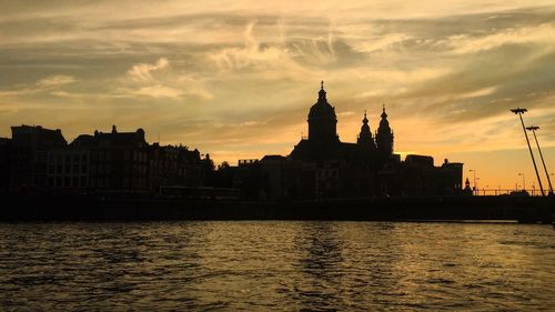 Silhouette of buildings at waterfront