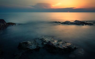 View of calm sea at sunset