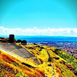 Scenic view of landscape against blue sky