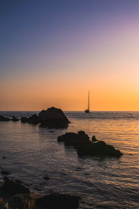 Scenic view of sea against sky during sunset