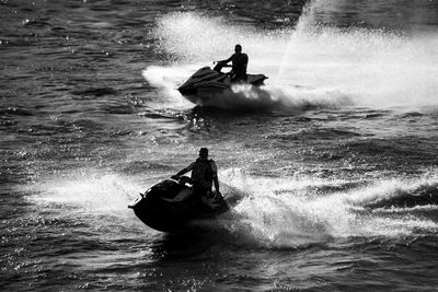 People in boat on sea