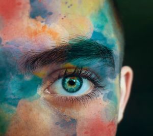 Close-up of human eye against black background