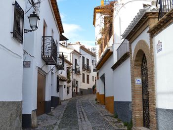 Narrow street amidst buildings in town