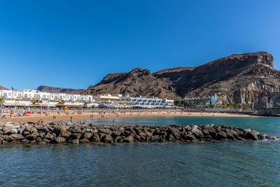 Scenic view of sea against clear blue sky