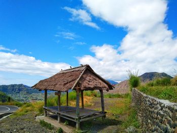 Built structure on field against sky