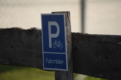 Close-up of information sign on wall