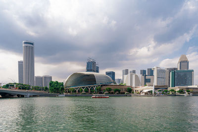City at waterfront against sky