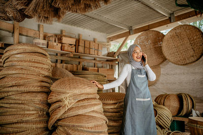 Rear view of woman standing in store