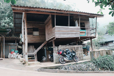 Abandoned building by street in city