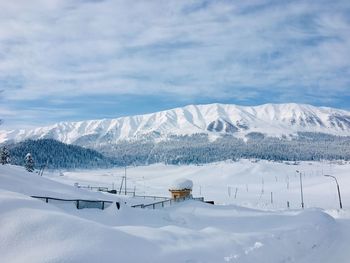 Scenic view of snowcapped mountains against sky