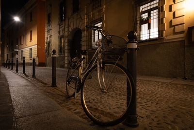 Bicycle parked on street in city