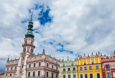  a beautiful renaissance town hall with multi-colored tenement houses. zamosc is an ideal city. 