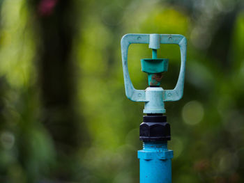 Close-up of fire hydrant against blue sky