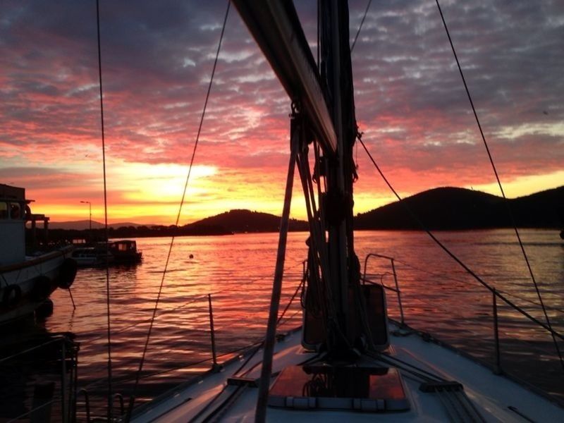 sunset, transportation, nautical vessel, mode of transport, sky, boat, water, orange color, cloud - sky, moored, sea, beauty in nature, scenics, cloud, cloudy, mast, nature, sailboat, mountain, travel