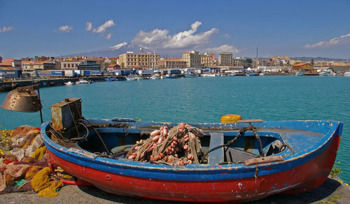 High angle view of boats moored in city