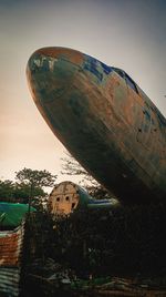 Low angle view of abandoned boat against clear sky