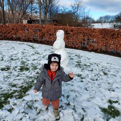 Portrait of boy playing in snow