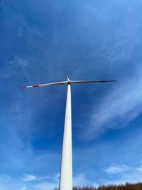 Low angle view of wind turbine against sky