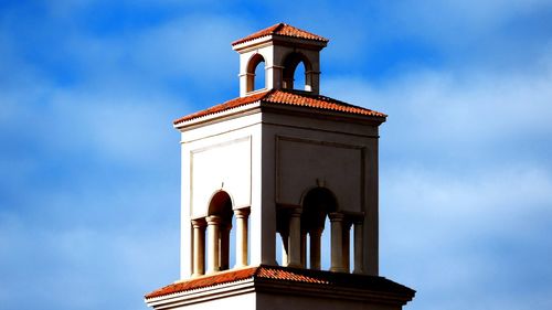 Low angle view of clock tower against sky