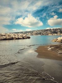 Scenic view of sea against cloudy sky