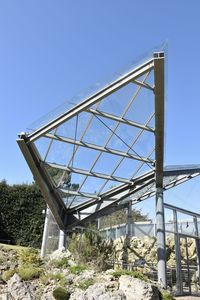 Low angle view of built structure against clear blue sky