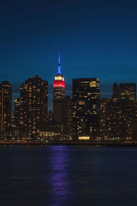 Illuminated buildings in city at night