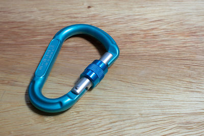 High angle view of blue container on wooden table