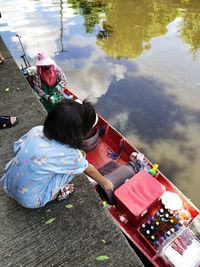 High angle view of people sitting in water