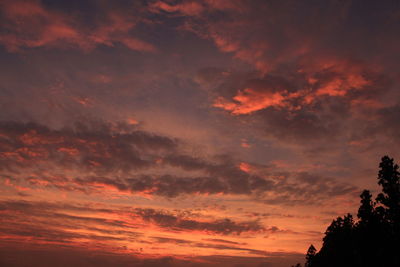 Low angle view of dramatic sky during sunset