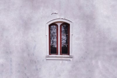 Low angle view of window on old building