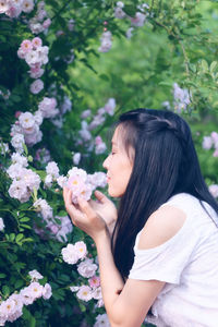 Close-up of woman holding flowers