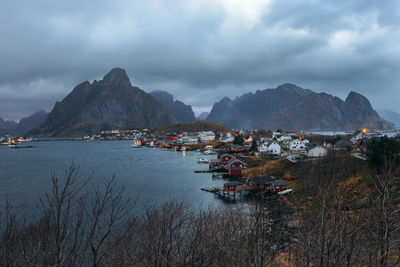 Scenic view of sea and mountains against sky