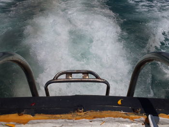 Close-up of rusty car against sea