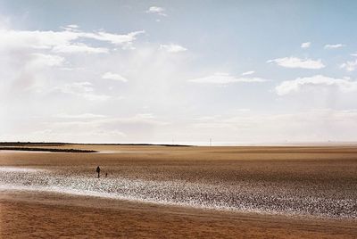 View of calm beach against the sky