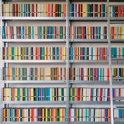 Full frame image of books arranged on shelves