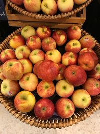 High angle view of apples in basket for sale