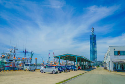 Cars on road against sky