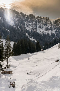 Scenic view of snow covered mountains against sky