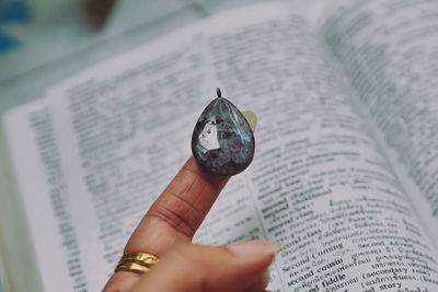 Close-up of hand holding book